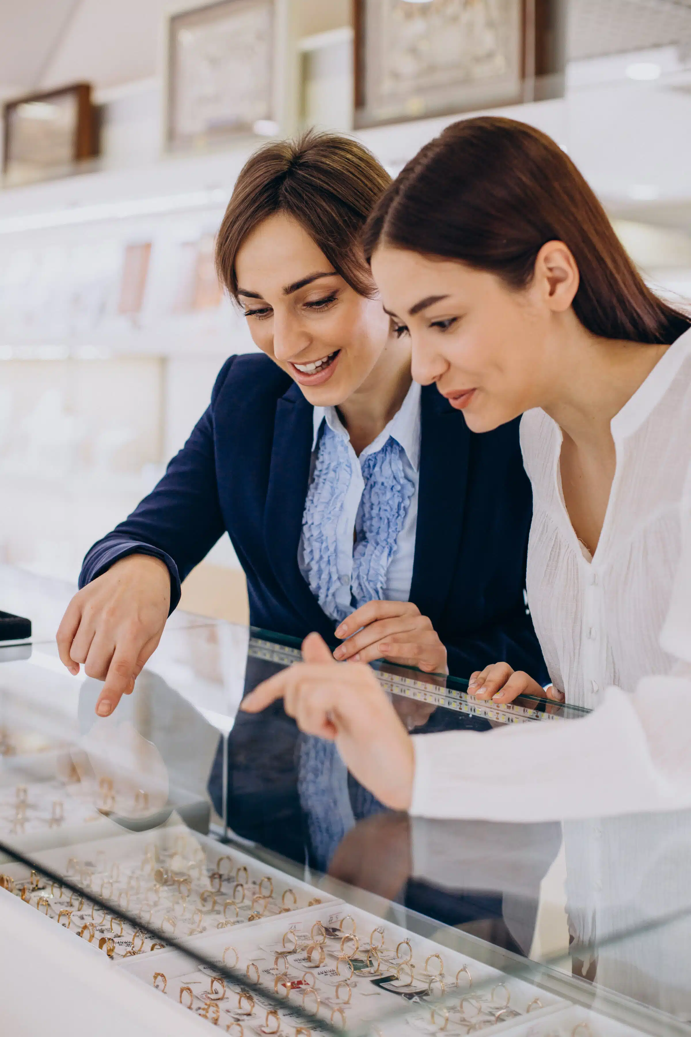 Couple at jewelry shop choosing a ring together
