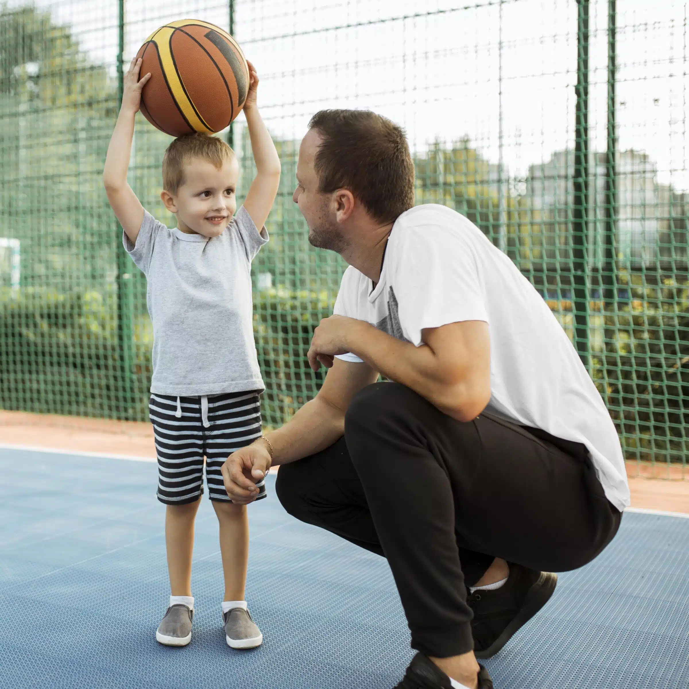 father-son-having-good-time-basketball-field